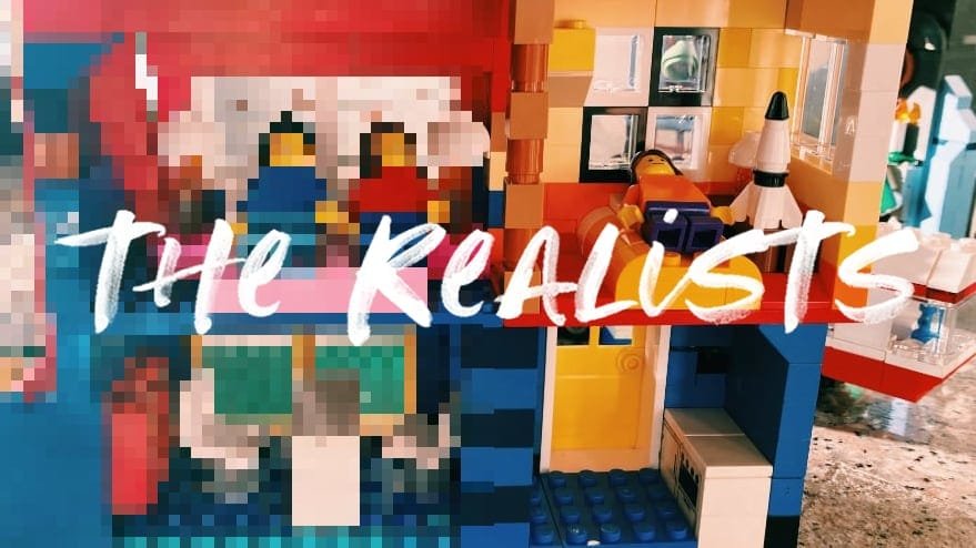 a photo of a LEGO house that is blurry on the left side, in focus on the right side, with the title on top THE REALISTS